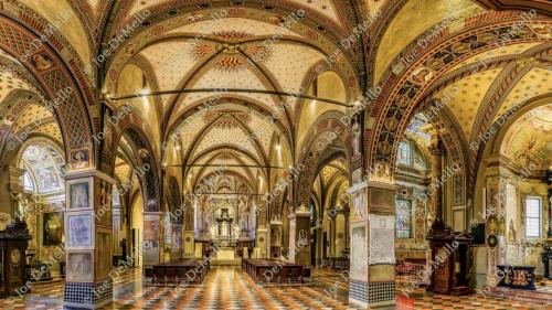 Inside Ascona Cathedral, the atmosphere is tranquil and intimate, with soft light filtering through the stained glass windows. The simple yet elegant design features beautiful wooden pews and a serene altar, evoking a sense of peace and devotion. The cathedral's warm, inviting interior offers a perfect space for reflection, adding to the romantic charm of this lakeside gem.