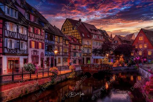 Colmar is a charming town in northeastern France, nestled in the Alsace region. Known for its beautifully preserved medieval and Renaissance architecture, Colmar features colorful half-timbered houses, cobblestone streets, and winding canals, earning it the nickname Little Venice. The town is famous for its vibrant floral displays, rich history, and as a key stop on the Alsace Wine Route, offering some of the best white wines in France.