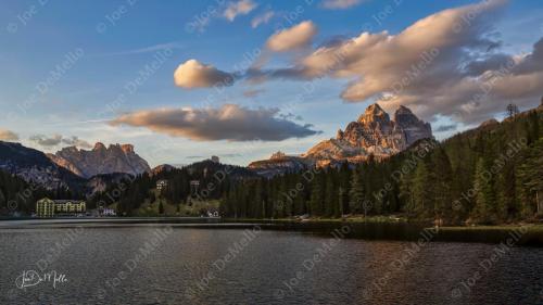 Lake Misurina, nestled in the heart of the Dolomites, is a breathtaking alpine lake known for its crystal-clear waters and stunning mountain reflections. Surrounded by towering peaks and lush forests, it exudes a serene and romantic charm, making it a perfect destination for nature lovers, photographers, and those seeking a peaceful retreat in the Italian Alps.