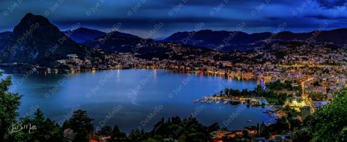 Lugano Bay, nestled on the shores of Lake Lugano in southern Switzerland, offers a stunning blend of serene waters and majestic mountain views. Surrounded by lush landscapes and charming Swiss towns, the bay is a peaceful retreat for nature lovers and outdoor enthusiasts.