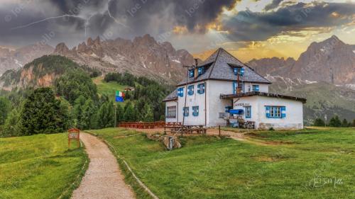 The Rosengarten (Catinaccio in Italian) is a stunning mountain range in the Dolomites of South Tyrol, Italy, famous for its dramatic peaks and the Enrosadira phenomenon, where the rocks glow pink at sunset.